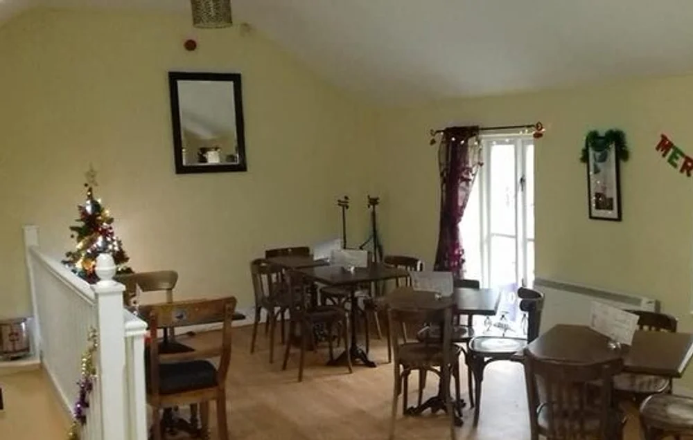 Cosy upstairs dining room with wooden tables